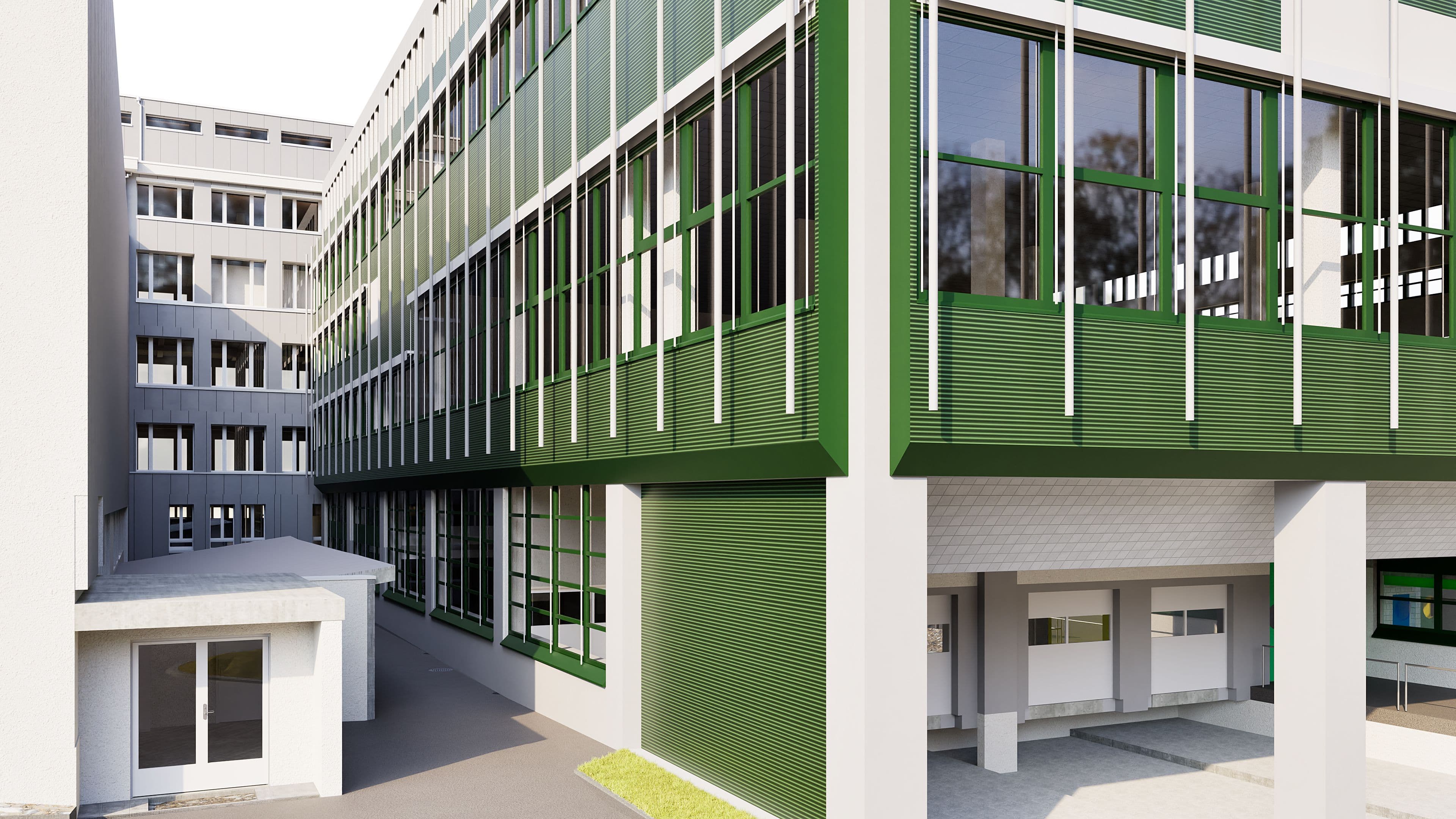 Ein modernes Schulgebäude mit grünen Fassaden und zahlreichen Fenstern in einem urbanen Umfeld.