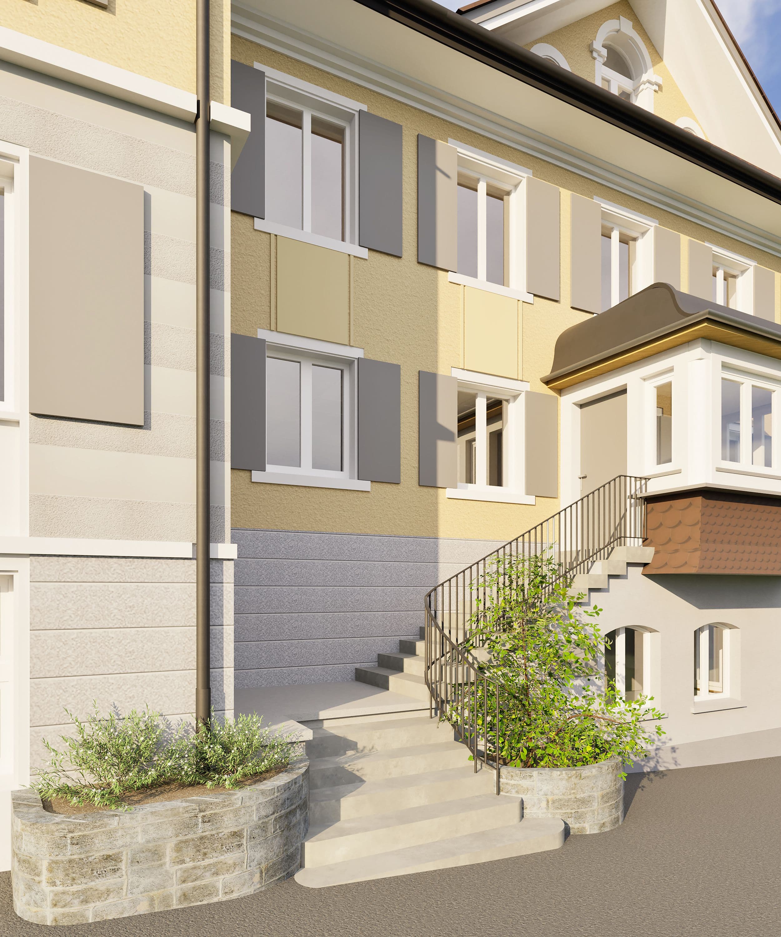 Wohnhaus mit hellen Fassadenfarben, Treppe mit Geländer, kleine Pflanzenbeete im Eingangsbereich.