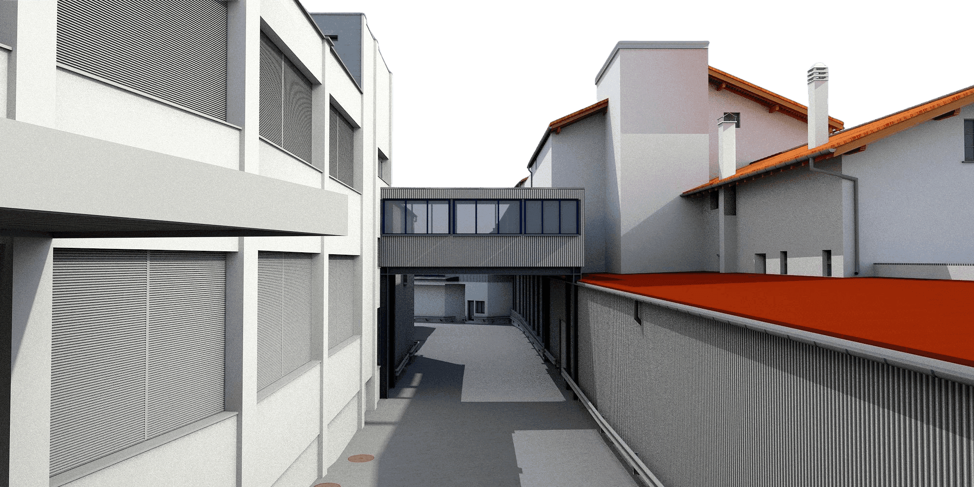 Ein moderner Gebäudekomplex mit Gehweg und Glasverbindungsteil, seitlich Flachdächer mit roten Ziegeln.