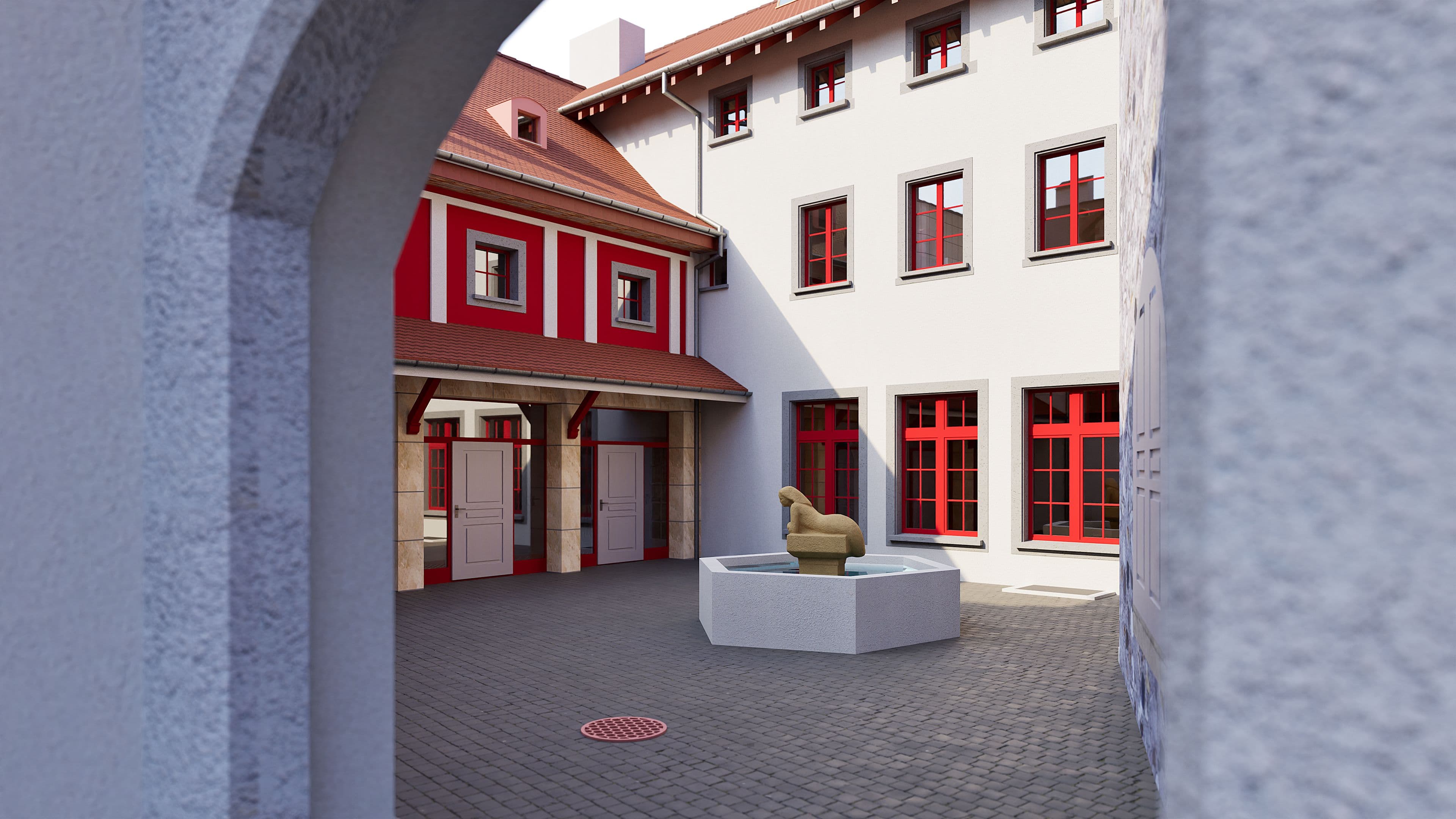 Innenhof eines historischen Gebäudekomplexes mit roten Fensterrahmen, gepflastertem Platz und Skulptur auf Sockel, Blick durch einen Torbogen bei Tageslicht.