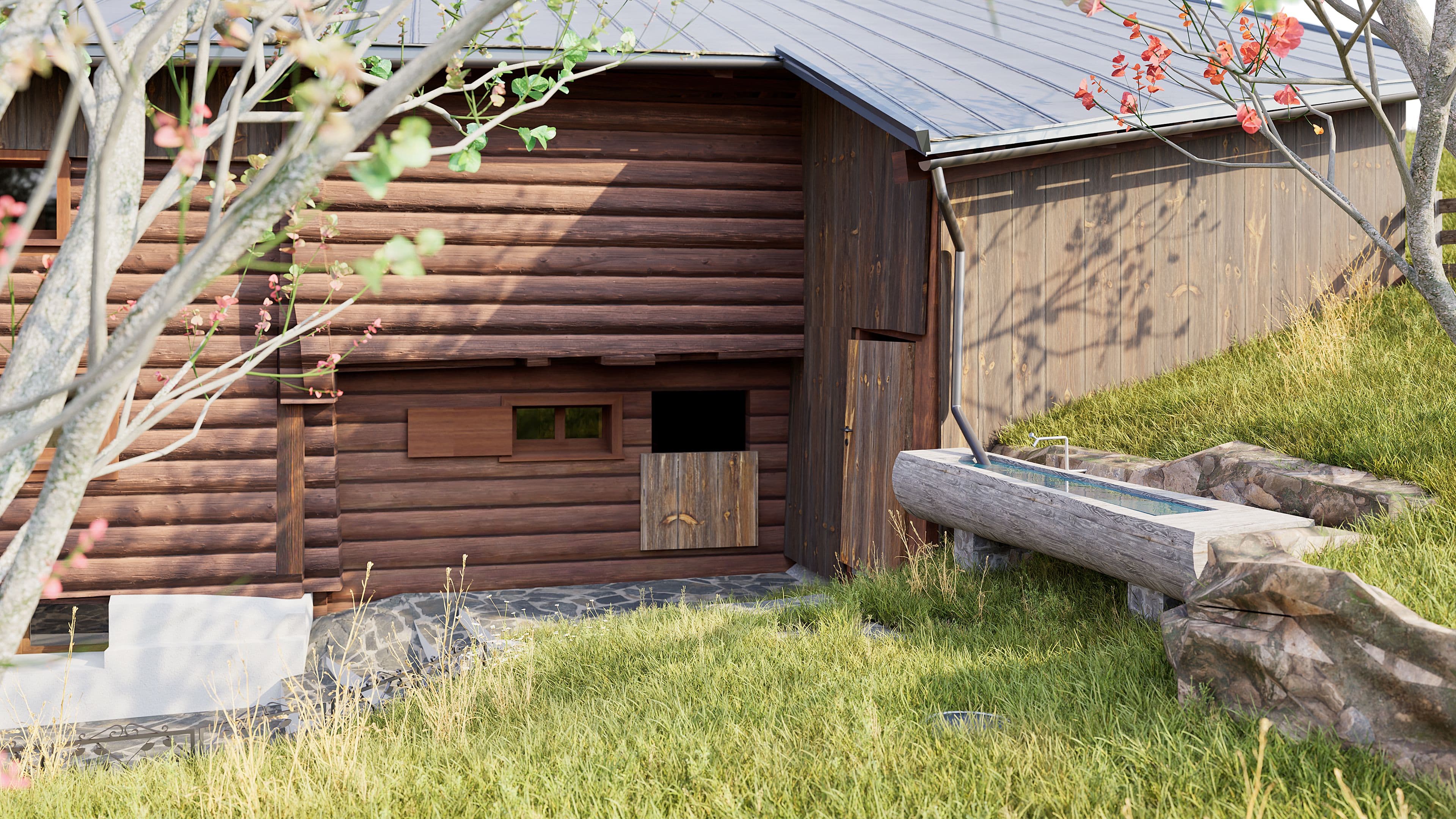 Holzhaus mit geneigtem Dach am Hang, umgeben von Gras und Bäumen; rechts ein Trog aus Stein oder Beton neben Felsen im Garten.