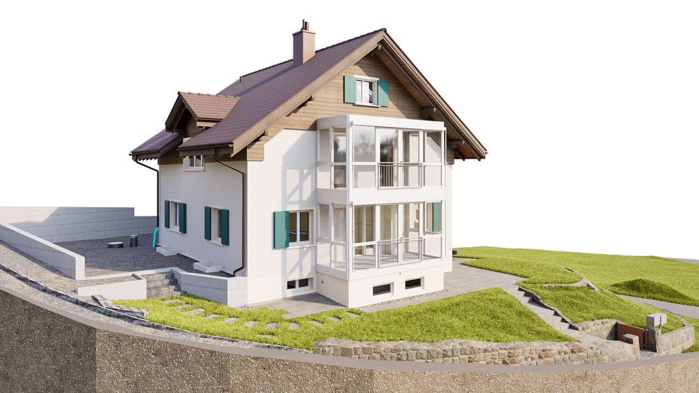 Ein modernes Einfamilienhaus mit Balkon, grünem Garten und Keller in Hanglage.