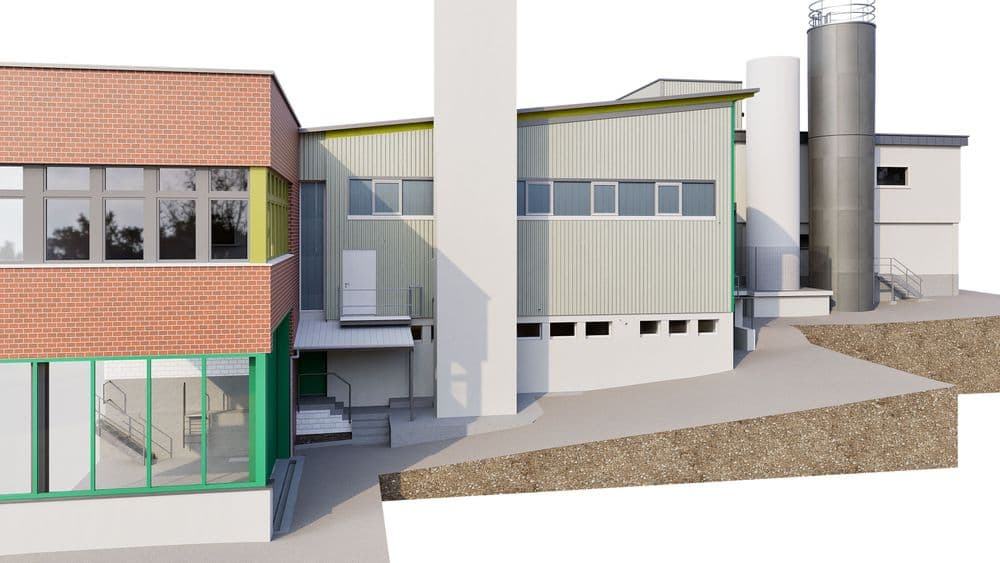 Industriegebäude mit roter Klinker- und moderner Metallfassade, angrenzendem Schornstein und silbernem Silo.