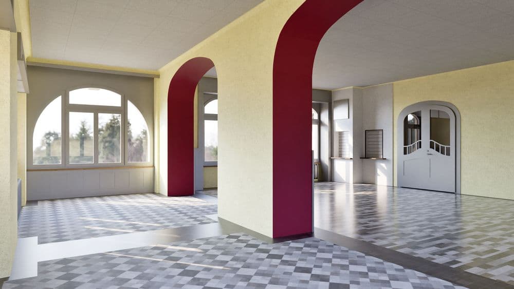 Ein leerer Raum im Bauhausstil mit großen Fenstern, roten Säulen und gemustertem Boden.