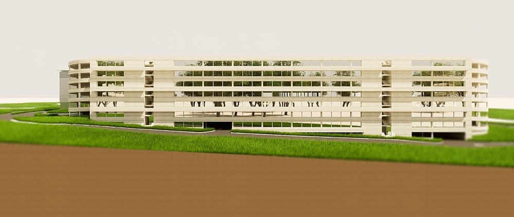 Modell eines modernen, geschwungenen Wohngebäudekomplexes auf grünem Untergrund.