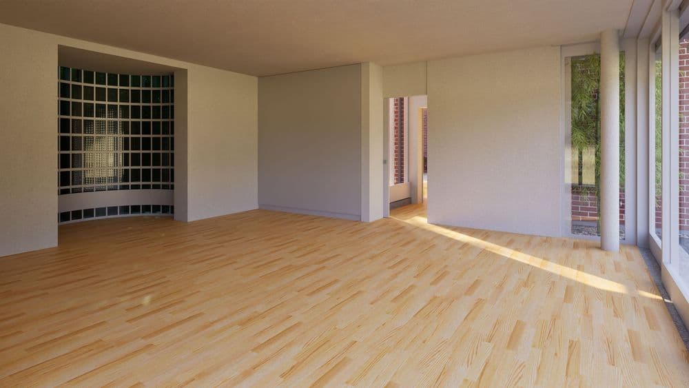 Heller, leerer Wohnraum mit hellem Holzboden, großen Fensterfronten, Blick ins Grüne und Glasbausteinwand; moderne, offene Architektur mit viel Tageslicht.