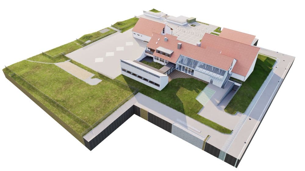 Modell eines modernen Gebäudekomplexes mit roten Dächern und grüner Umgebung.