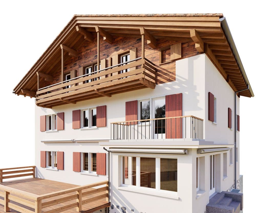 Modernes Alpen-Chalet: weißes Wohnhaus mit Holzgiebel, großem Balkon, Fensterläden und Terrasse, freigestellt vor weißem Hintergrund.