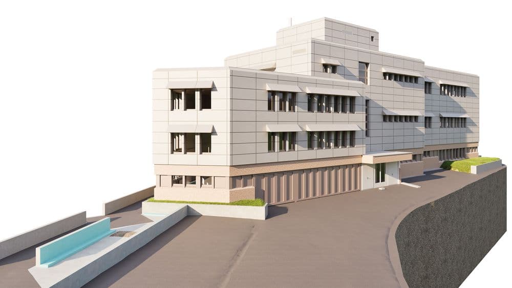 Modernes, mehrstöckiges Gebäude mit flachem Dach und Balkonen an einer Straßenecke.