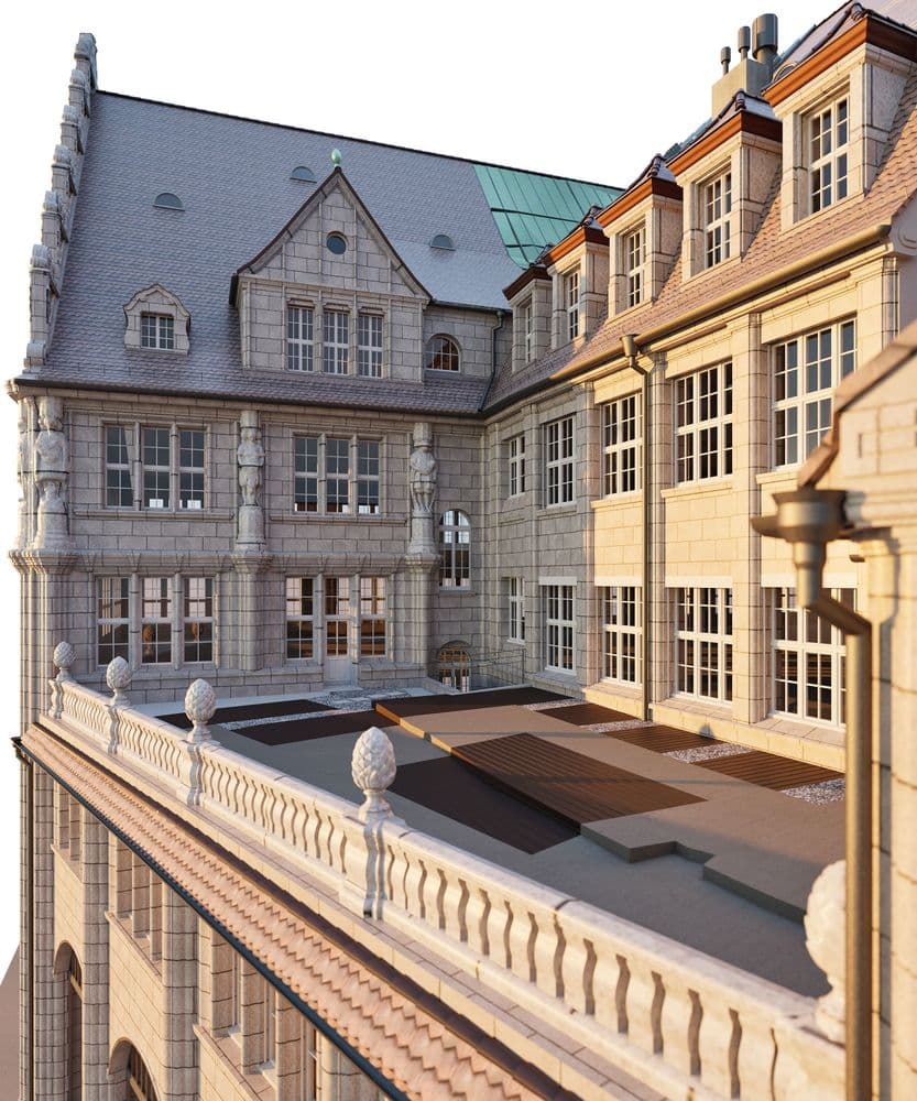 Historisches Gebäude mit Steinfassade und Erker, Dachgauben und Terrasse.