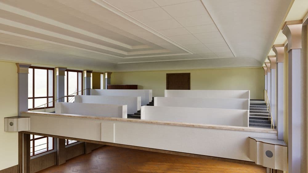 Ein moderner, heller Raum mit großen Fenstern, weißen Trennwänden und Holzboden.