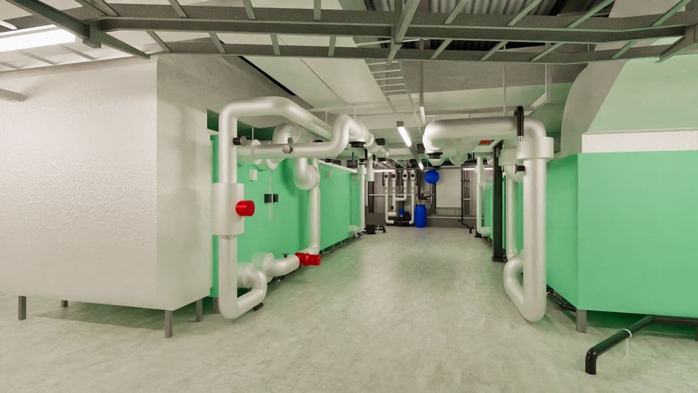 Industrieller Maschinenraum mit grünen Wänden und weißen Rohrleitungen.