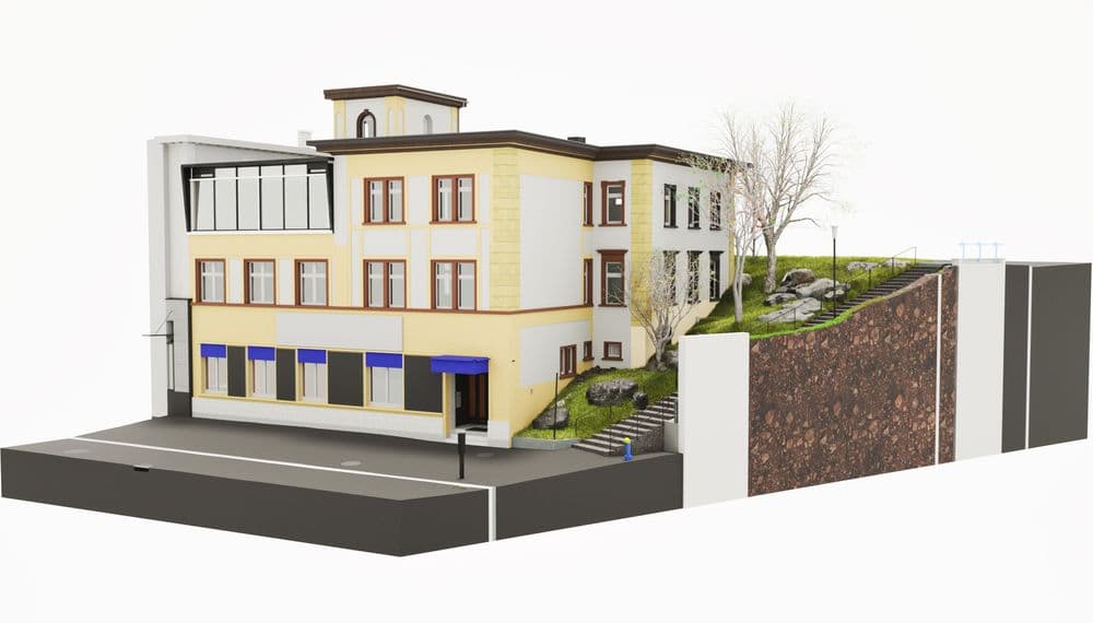 Ein modernes Gebäude mit gelber Fassade, großen Fenstern und einem begrünten Hang daneben.