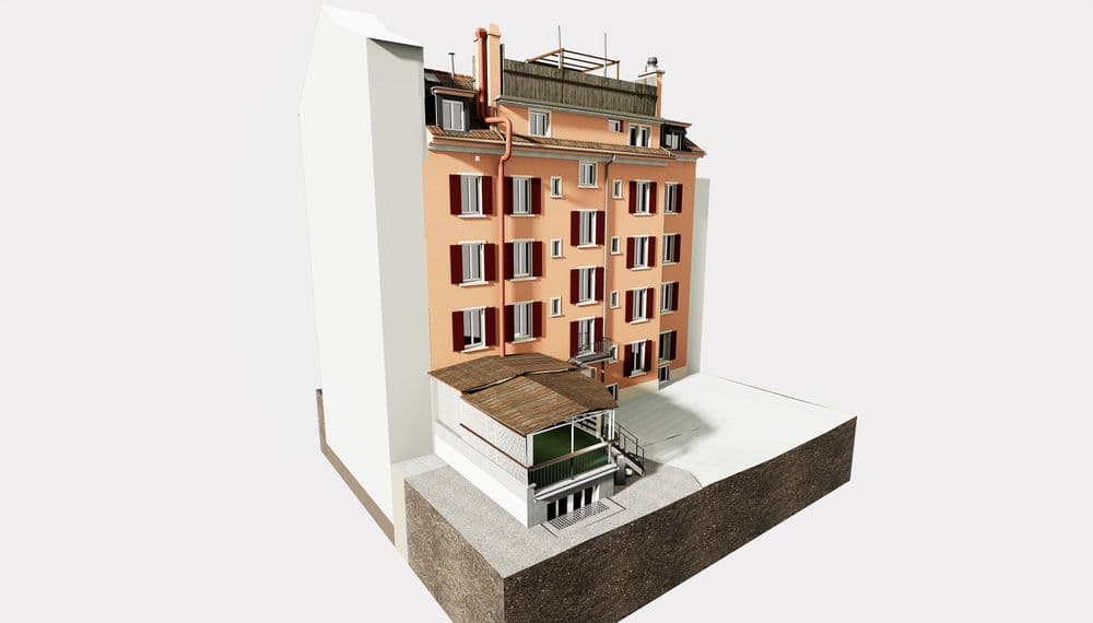 Ein mehrstöckiges, renoviertes Gebäude mit roter Fassade und großen Fenstern.