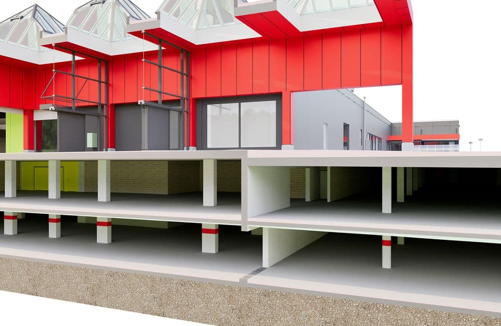 Architekturmodell eines modernen Gebäudes mit roten Fassadenelementen, Glasdächern und detailierter Etagenansicht. Ideal für Bauplanung und Designkonzepte.
