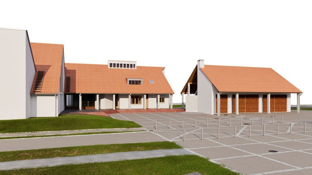 Moderne Gebäude mit roten Ziegeldächern, großer gepflasterter Fläche und Grünflächen im Vordergrund.