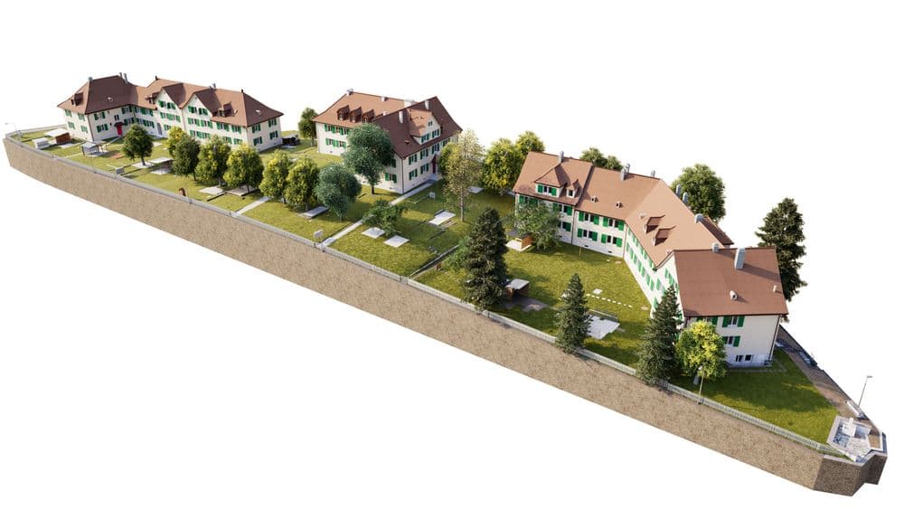 3D-Architekturvisualisierung eines Wohn- oder Klinikkomplexes mit mehreren Gebäuden, roten Dächern, grünen Fassaden, Innenhof, Wegen und Bäumen in isometrischer Ansicht.