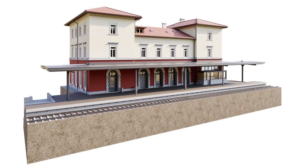 3D-Rendering eines historischen Bahnhofsgebäudes mit Bahnsteigüberdachung, Gleisen und Warteraum, beige-rote Fassade und Satteldach, perspektivische Ansicht auf weißem Hintergrund.