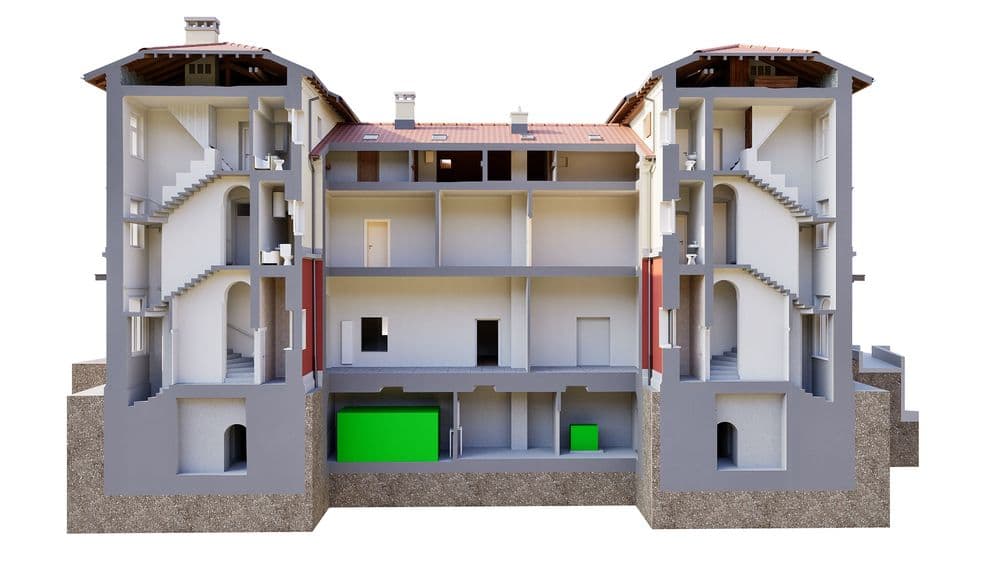3D-Querschnitt eines mehrstöckigen Gebäudes mit Treppenhäusern und Innenräumen; Architektur-Visualisierung/Schnittmodell mit Keller und Dach, grün markierten Bereichen.