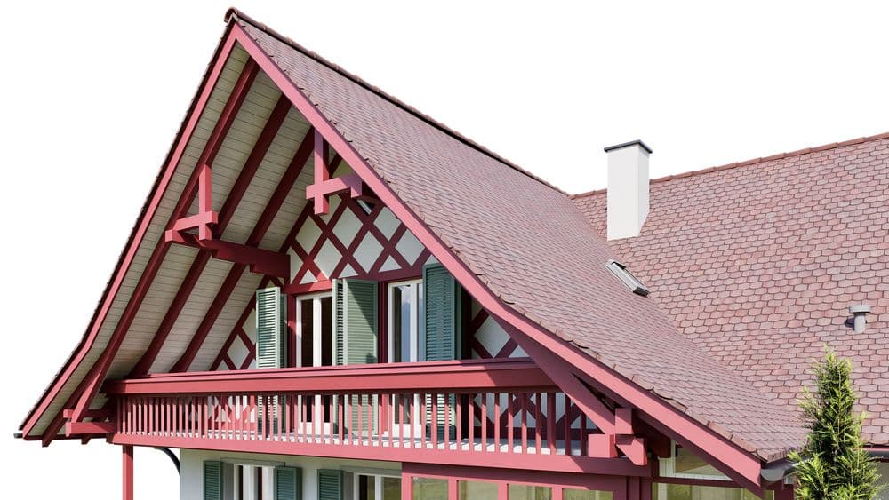 Das Bild zeigt ein modernes Einfamilienhaus mit rotem Satteldach und Holzbalkon.