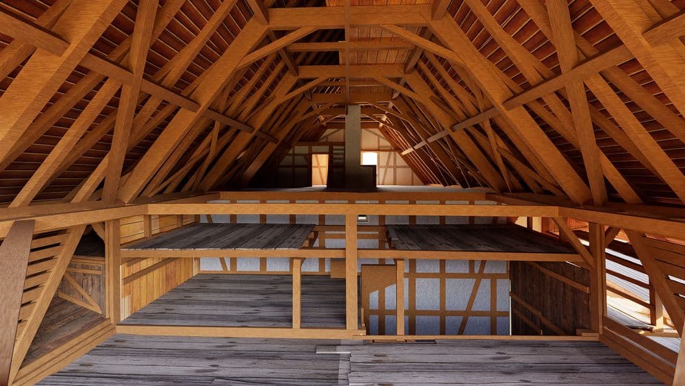 Holz-Dachstuhl eines ausgebauten Dachbodens mit sichtbaren Balken, Galerie und Dachfenstern, Blick in den Giebelbereich eines Hauses.