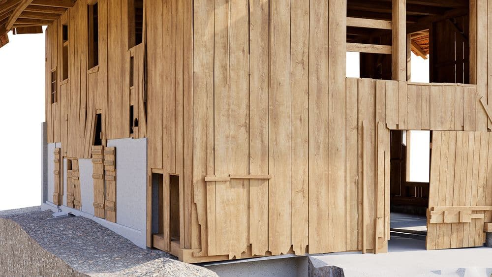3D-Rendering eines im Bau befindlichen Holzhauses mit Bretterverschalung, offenen Fenster- und Türöffnungen sowie rohem Holzrahmen auf Fundament bei Tageslicht.