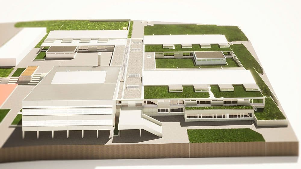 Architekturmodell eines modernen Campus mit mehreren Gebäuden und Grünflächen.