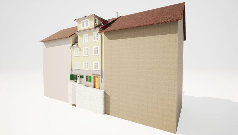 Mehrfamilienhaus mit detailreichen Fassaden, roten Dächern und architektonischen Besonderheiten.