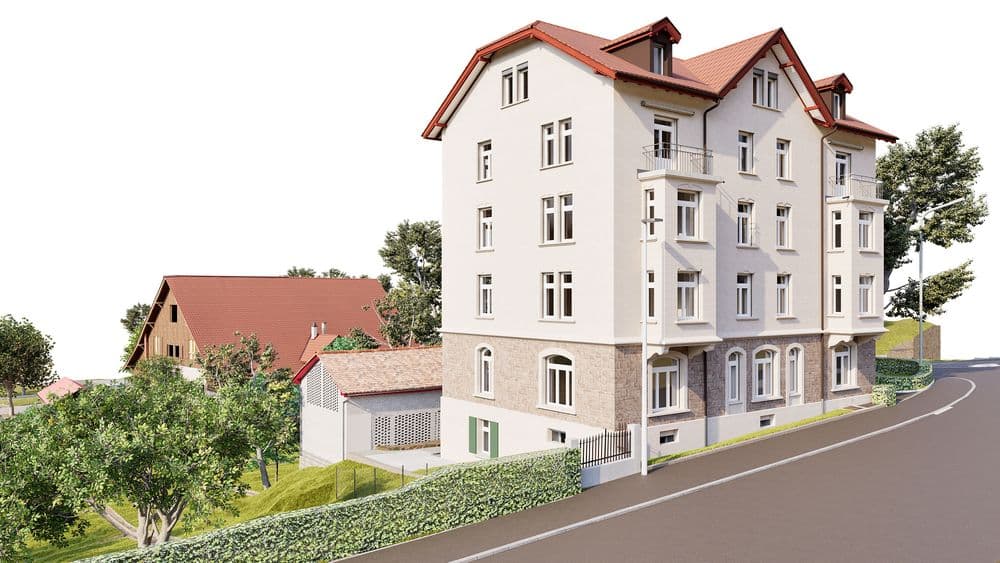3D-Visualisierung eines hellen Mehrfamilienhauses mit rotem Satteldach an einer Straße, Balkonen und großen Fenstern, umgeben von Grünflächen und Nebengebäuden am Hang.