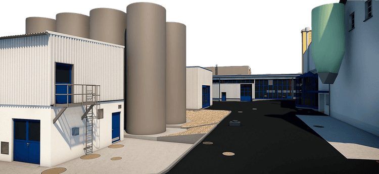 Industrielle Anlage mit mehreren Silos, modernen Gebäuden und Asphaltfläche bei Tageslicht.